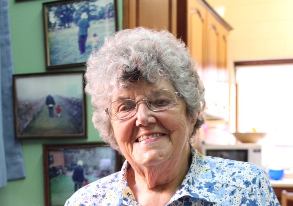 MMHS resident Gwenda Watson is smiling in her kitchen